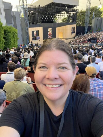 Laura Beatty selfie at Google I/O 2026 keynote, Shoreline Amphitheatre.